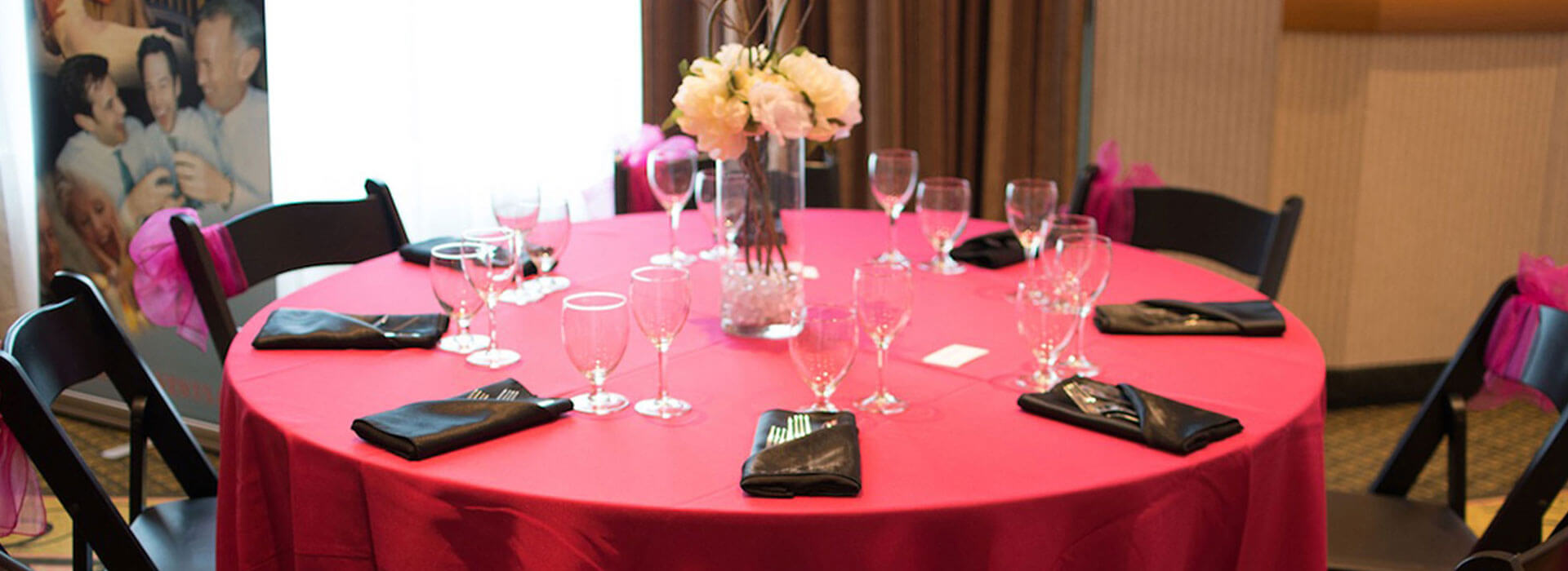 Elegant table with red table cloth, wine glasses and flowers at Holiday Inn North Vancouver