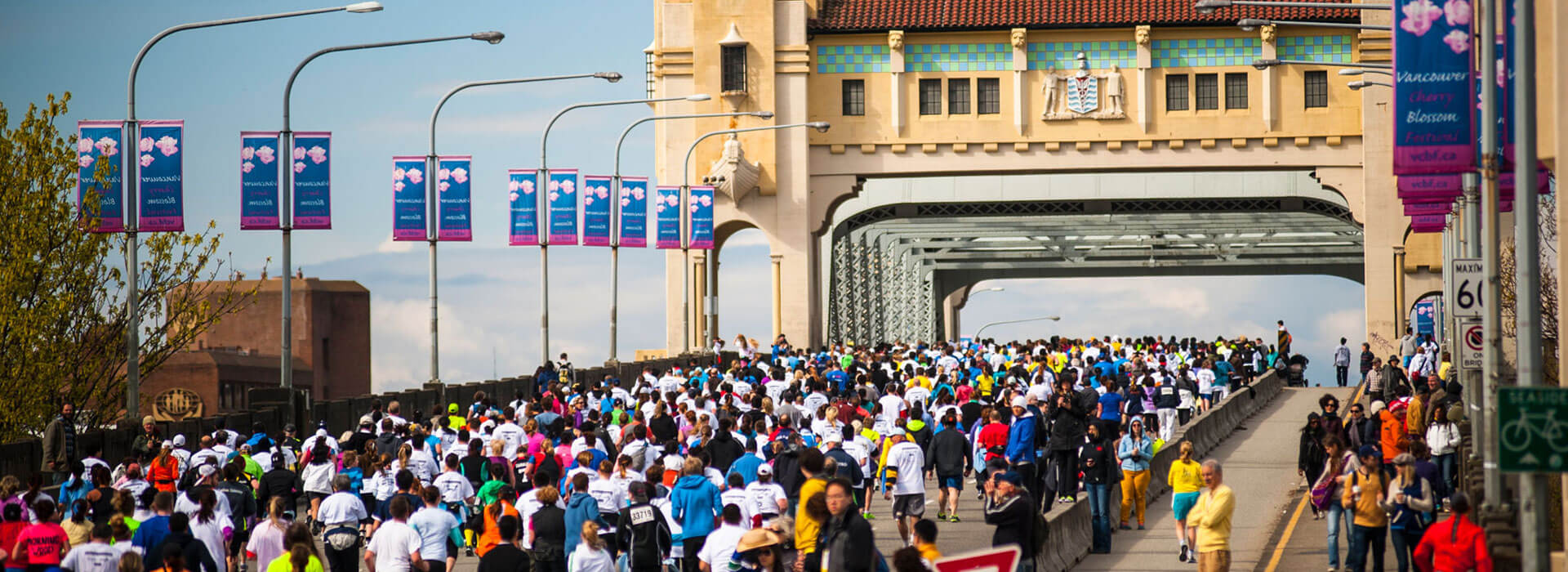  Local events where crowds of people are walking across the Burrard Street Bridge