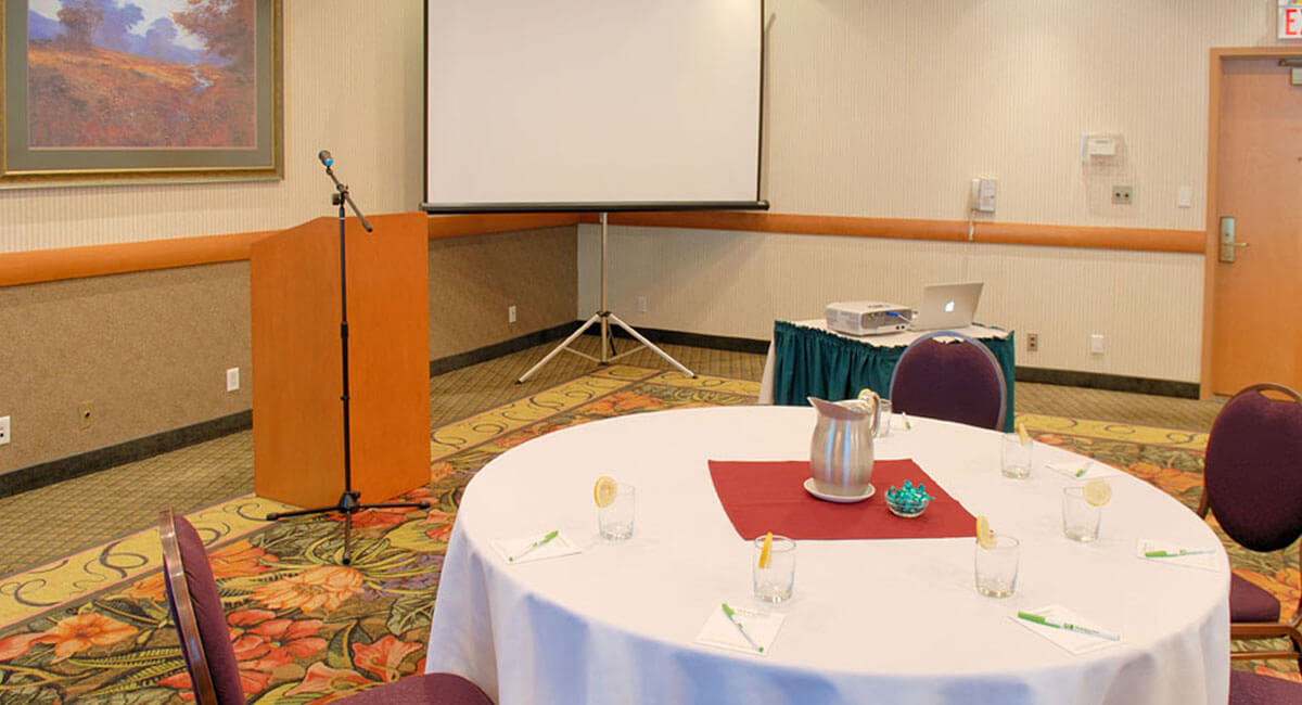 Speaker's podium and screen set up in the meeting room at Holiday Inn North Vancouver