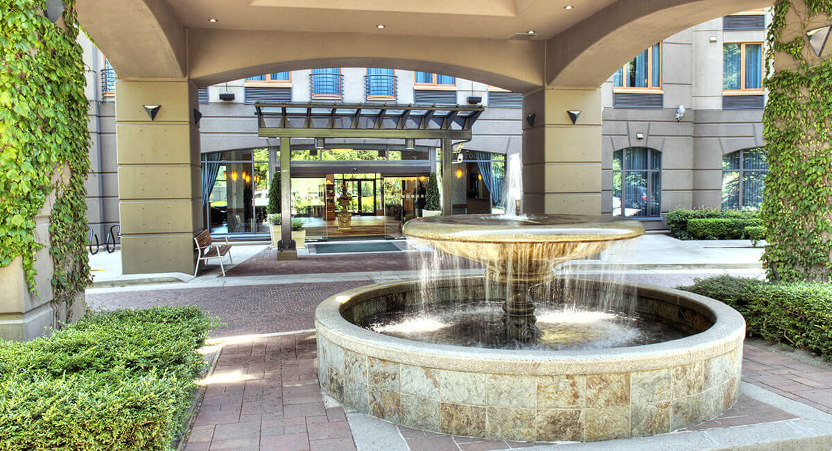 A water fountain greets visitors and guests at the front entrance to the Holiday Inn North Vancouver