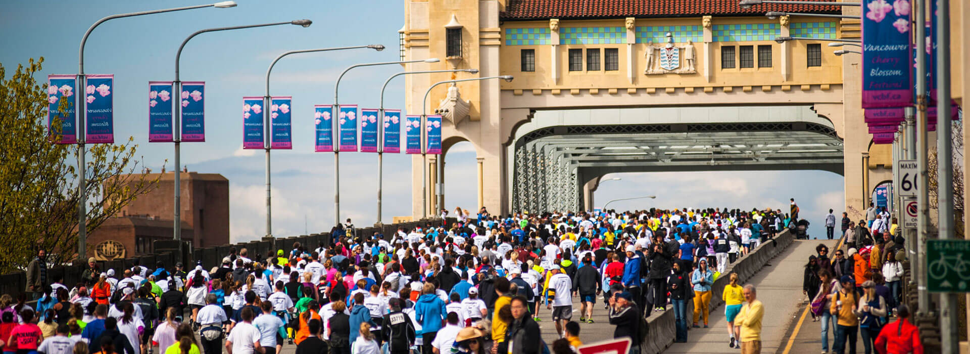 Local events where crowds of people are walking across the Burrard Street Bridge