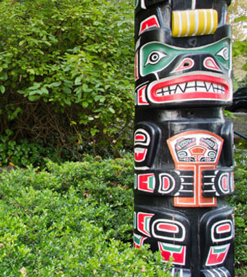 Native art set against the green scenery of nature 